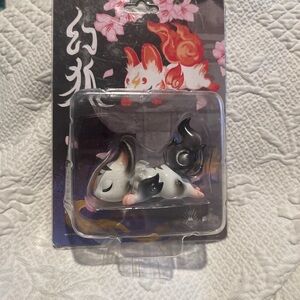 Black and White Sleeping Fox figurine by Genkosha new in box. Box has wear
